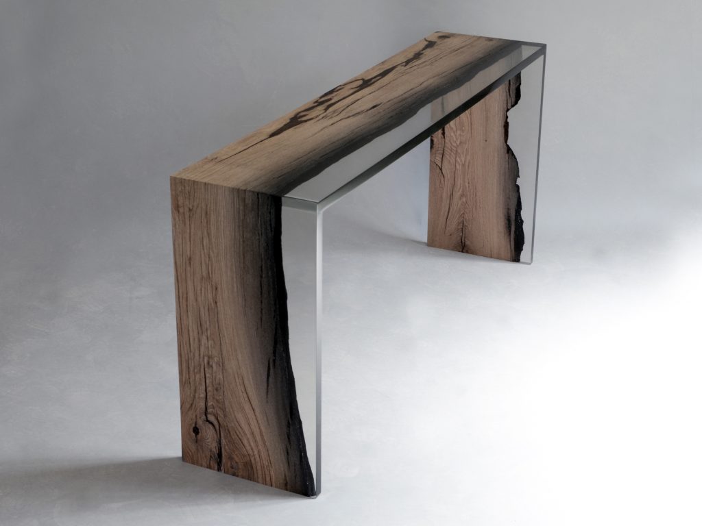 console made of roeble wood base coated in resin on a gray background