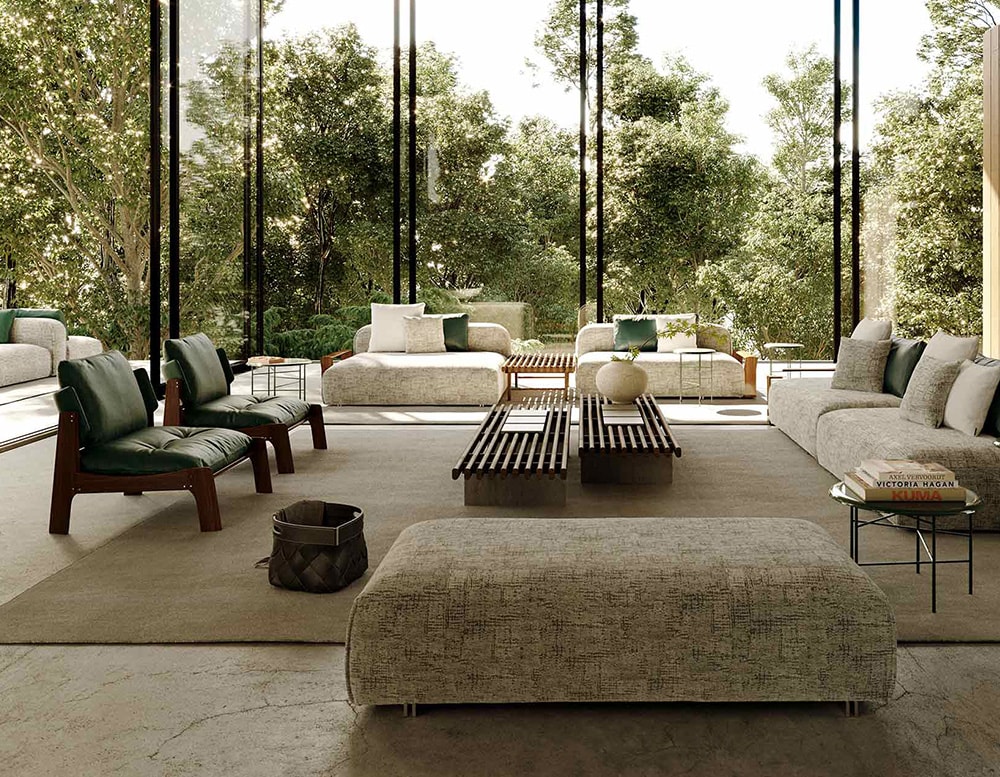 chairs made of light brown wood and dark green leather in a living room.