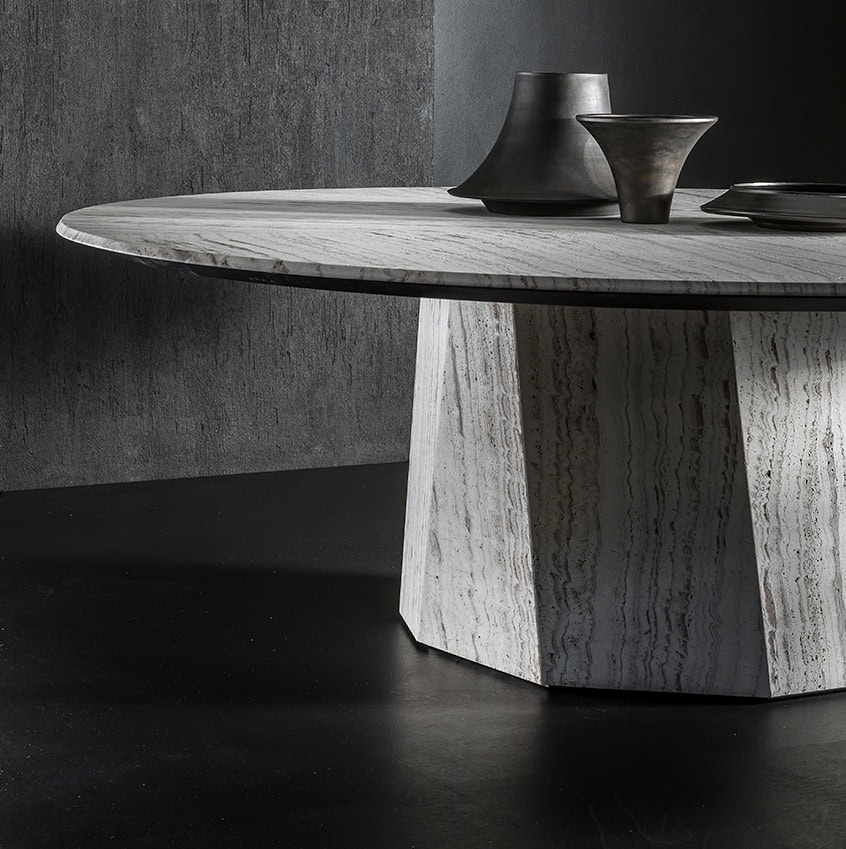 round dining table made in-house in steel covered in gray stone and wooden tops